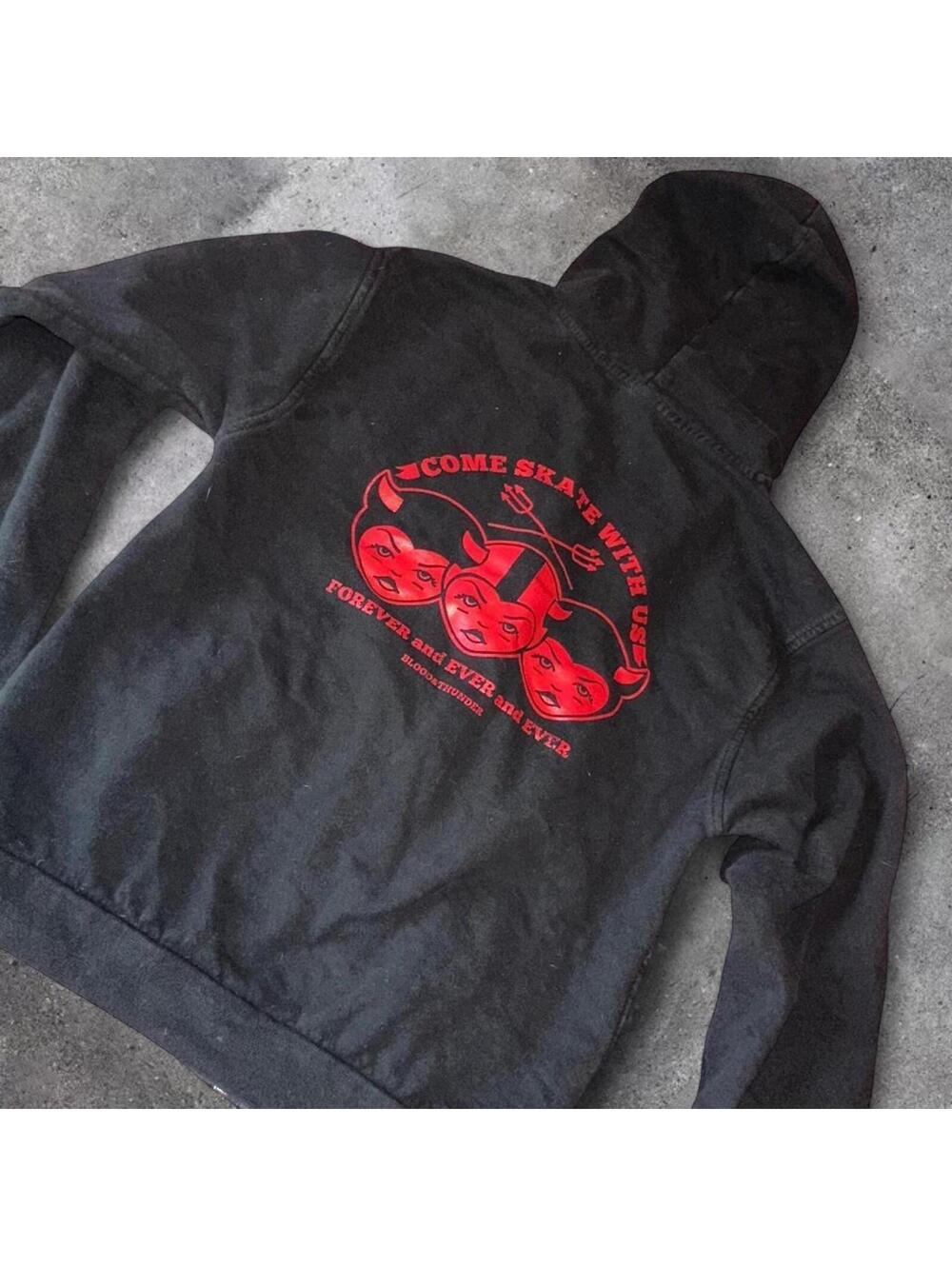 black and red graphic zip up hoodie, size Medium